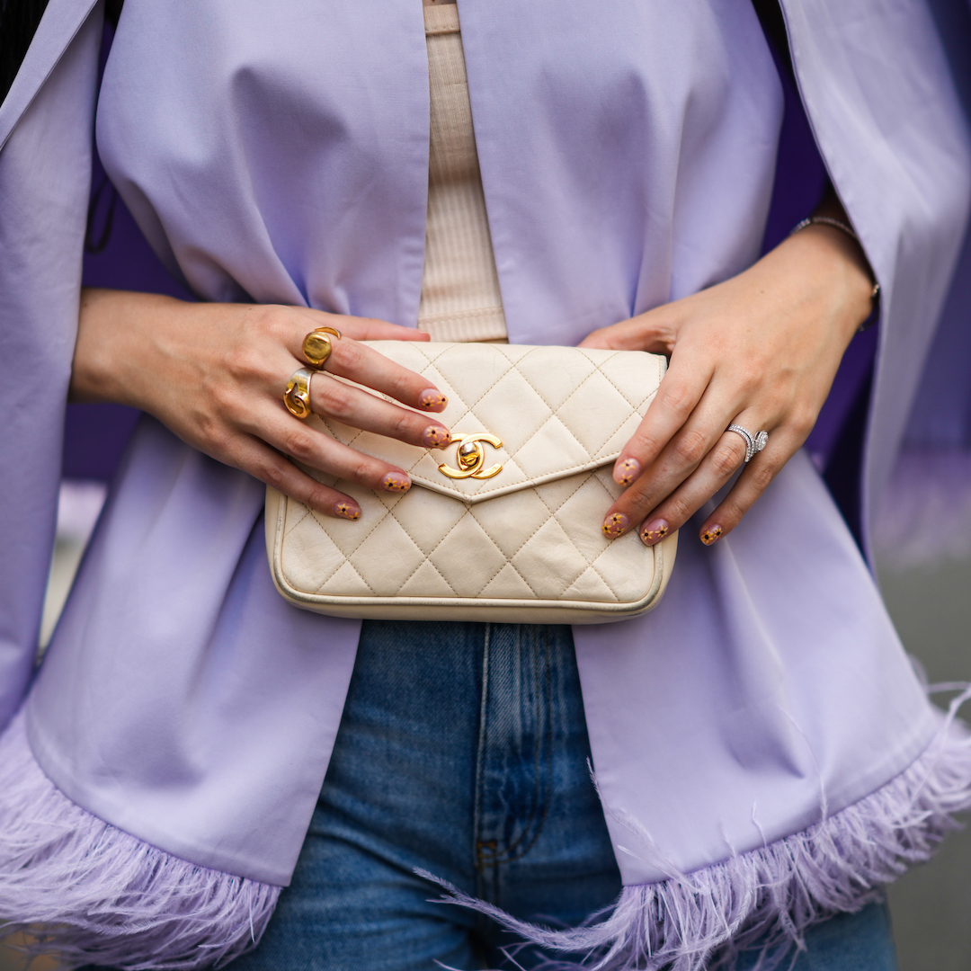 woman with lilac jacket, chanel bag and floral nails for spring