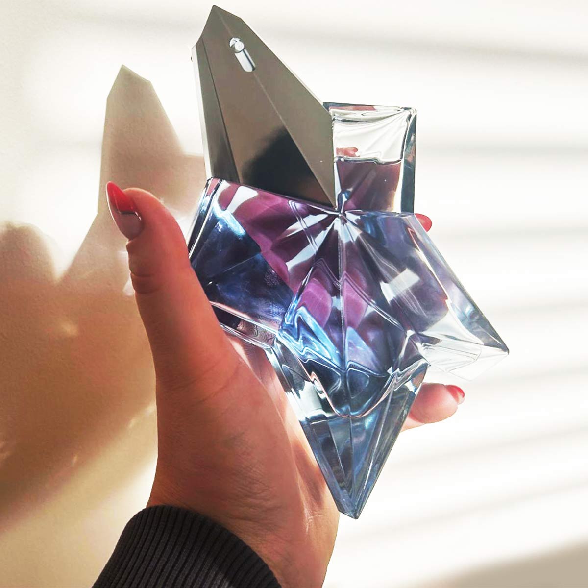 Tori holding Mugler Angel